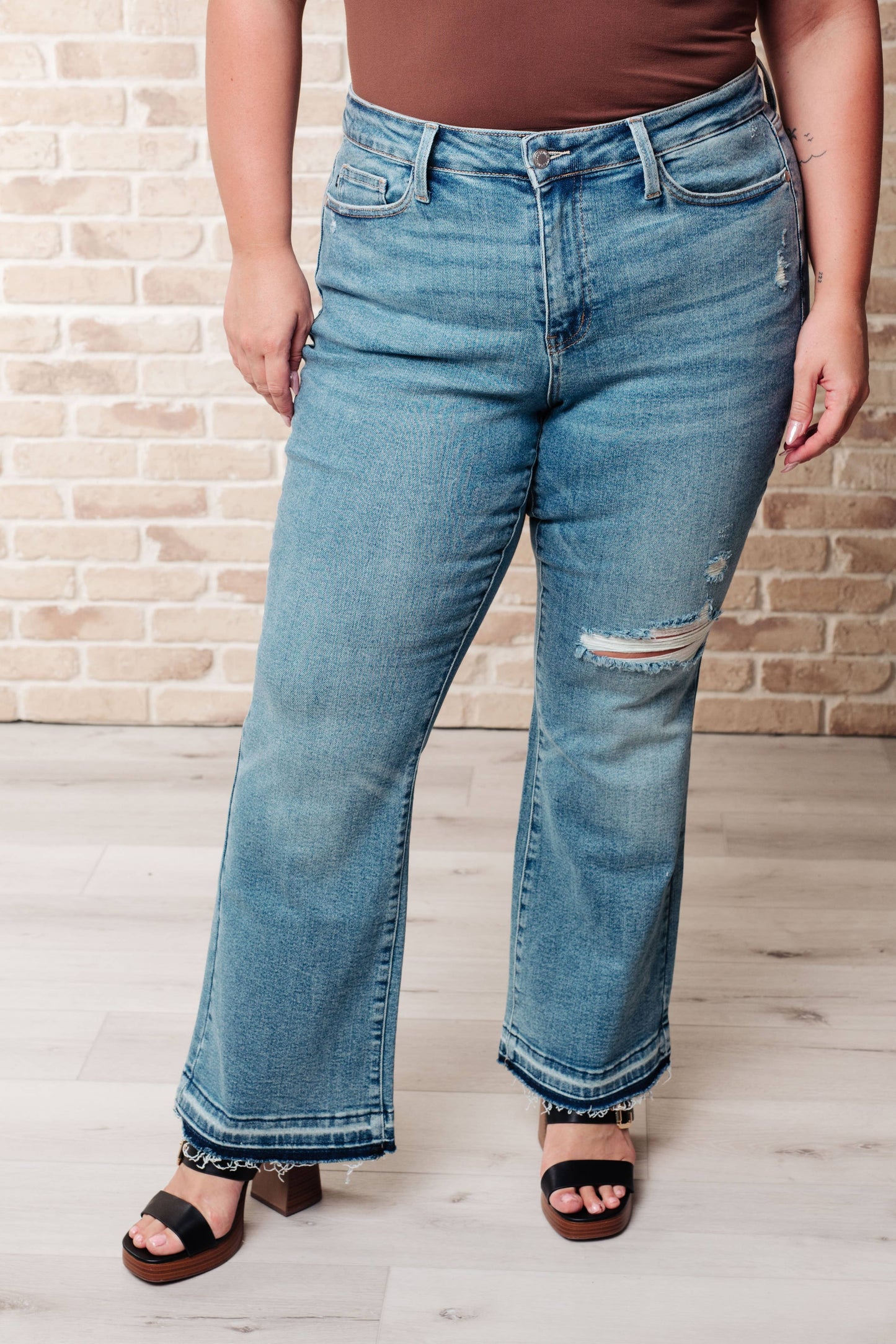 Judy Blue Mid Rise Distressed Released Hem Bootcut Jeans: 5/27
