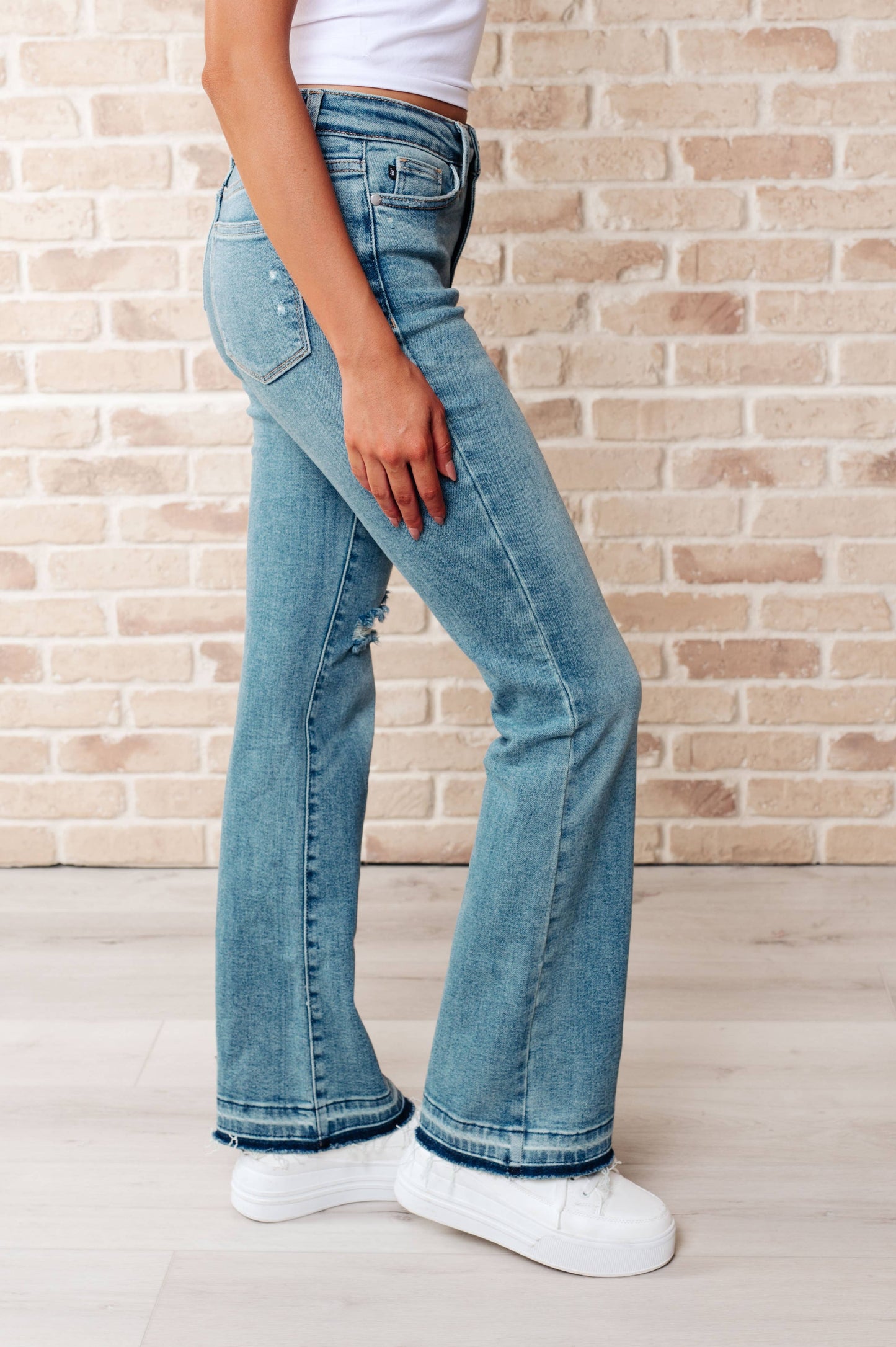 Judy Blue Mid Rise Distressed Released Hem Bootcut Jeans: 11/30